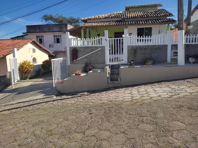 Venda de duas casas em Iguaba Grande, quintal varanda, cisterna com 12 mil litros. Garagem - Iguaba Grande - 