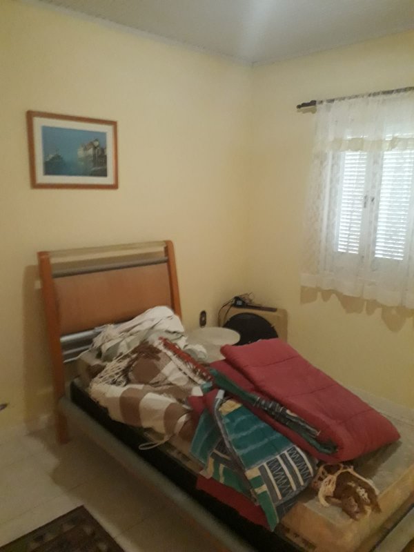 Casa com 3 quartos, 1 suíte, dois terrenos, a 3 quadras do mar. Frente Oeste Rua Irai Capão da Canoa - 