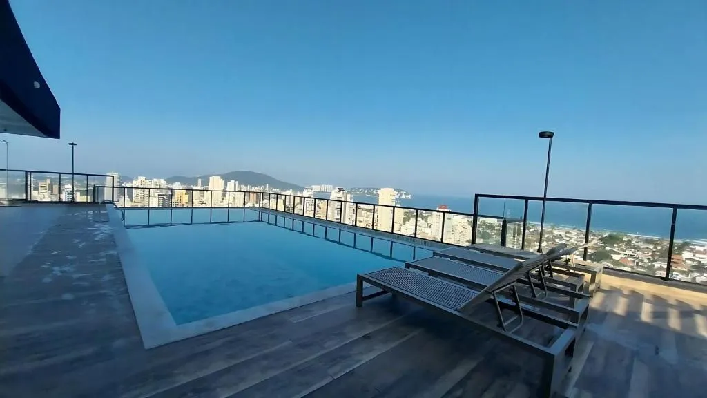 Apartamento na praia da Enseada no Guaruj&aacute; com piscina no terra&ccedil;o com vista para o mar Rua Begônia Guarujá - 